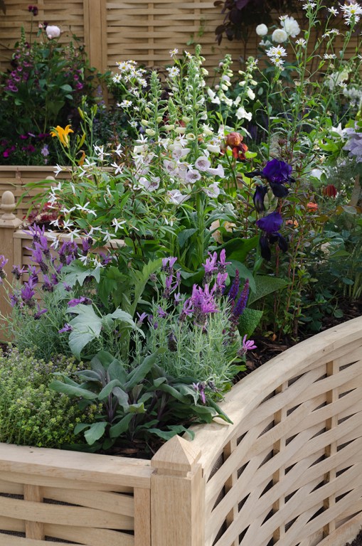 The Garden Design for a Quercus Trade Stand project, includes modern cottage garden style planting.