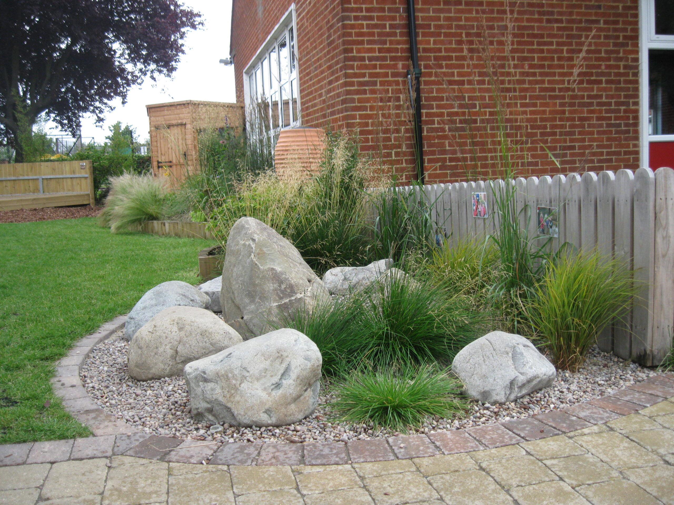 The garden design features a Rock Fountain Area and Gravel Garden Area.